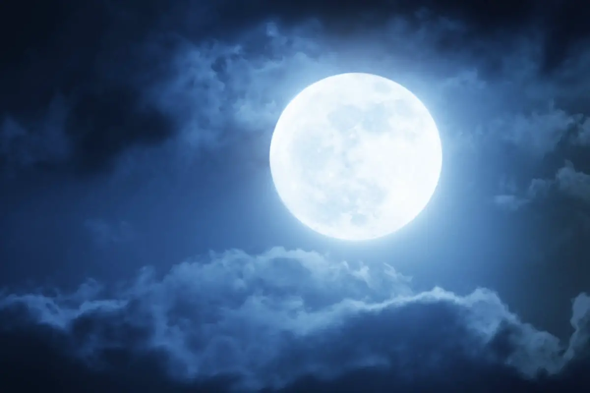 Moon in a cloudy night sky