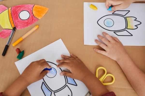 Kids coloring paper rockets